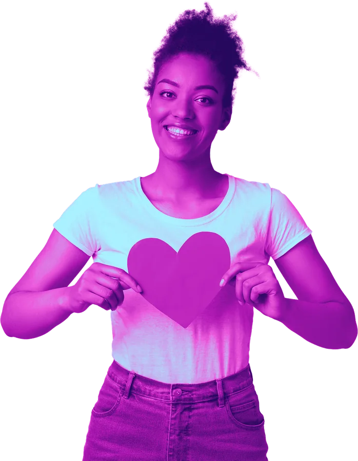 Smiling woman holding a paper heart
